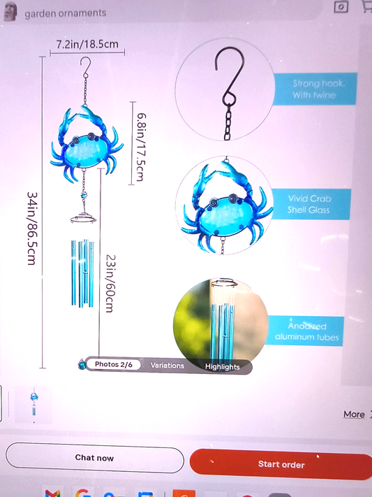 blue crab-themed wind chime featuring a vibrant blue crab at the top and silver