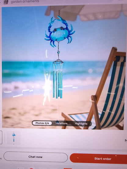 blue crab-themed wind chime featuring a vibrant blue crab at the top and silver-
