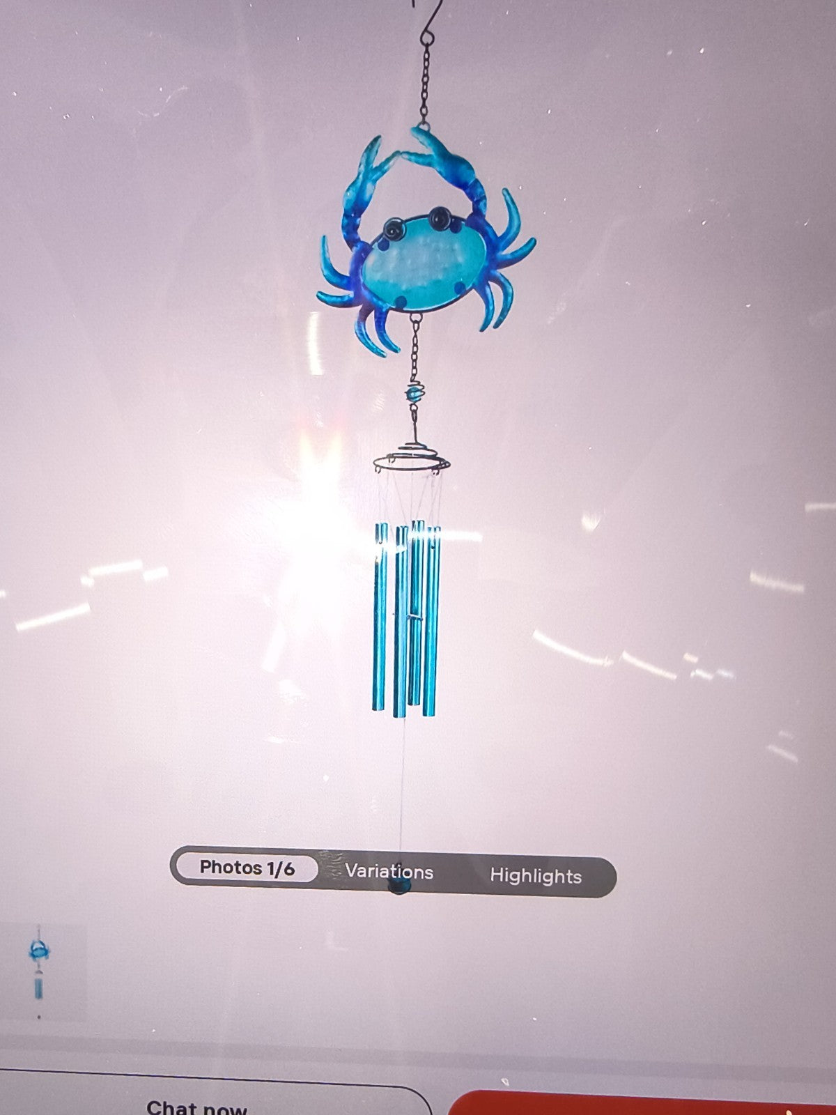 blue crab-themed wind chime featuring a vibrant blue crab at the top and silver-