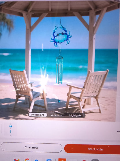 blue crab-themed wind chime featuring a vibrant blue crab at the top and silver-